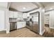 Bright kitchen features stainless steel appliances, white cabinets, and stylish countertops at 10215 N 23Rd St, Tampa, FL 33612