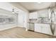 Kitchen and dining space with stainless steel appliances and modern finishes at 10215 N 23Rd St, Tampa, FL 33612