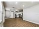 Spacious living area with stylish laminate wood floors and bright lighting at 10215 N 23Rd St, Tampa, FL 33612