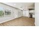 Inviting living space with new laminate floors, a front door with glass and neutral colors at 10215 N 23Rd St, Tampa, FL 33612