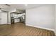 Bright living room with open access to kitchen, with modern lighting and sleek flooring at 10215 N 23Rd St, Tampa, FL 33612