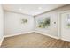 Bright living room with new laminate floors, front door with glass and neutral colors at 10215 N 23Rd St, Tampa, FL 33612