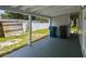 Spacious covered patio offering a versatile outdoor area for leisure and storage at 10215 N 23Rd St, Tampa, FL 33612