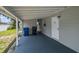 Relaxing covered patio offering ample space for outdoor seating and entertainment at 10215 N 23Rd St, Tampa, FL 33612