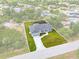 An aerial view showcases this home's layout, set within a lush landscape and defined property lines at 10237 Deerwood Ave, Englewood, FL 34224