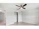 Bedroom with large window, ceiling fan, closet, and tile floor at 10237 Deerwood Ave, Englewood, FL 34224