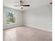 Bedroom with large window and beautiful outdoor view and ceiling fan at 10237 Deerwood Ave, Englewood, FL 34224