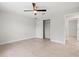 This bedroom offers a ceiling fan and closet, providing comfort and storage solutions at 10237 Deerwood Ave, Englewood, FL 34224