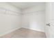 Walk-in closet featuring plenty of wire shelving for the organization of your wardrobe at 10237 Deerwood Ave, Englewood, FL 34224