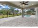 Screened-in pool deck featuring plenty of room for entertaining and lounging at 10237 Deerwood Ave, Englewood, FL 34224