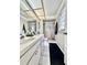 Functional bathroom featuring double sinks, a shower, and a well-lit vanity at 10636 Millriver Dr, New Port Richey, FL 34654