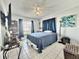 This bedroom features tile flooring, a ceiling fan, and a television on the wall at 10636 Millriver Dr, New Port Richey, FL 34654