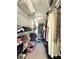 Walk-in closet with wire shelving, shoe organizers, and hanging space for clothes at 10636 Millriver Dr, New Port Richey, FL 34654