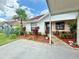 Cozy single-story home boasting a well-maintained lawn with vibrant landscaping and a functional carport at 10636 Millriver Dr, New Port Richey, FL 34654
