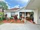 Charming single-story home featuring a carport, well-maintained landscaping, and a welcoming front entrance at 10636 Millriver Dr, New Port Richey, FL 34654