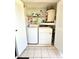 Laundry room with washer, dryer and shelving at 10636 Millriver Dr, New Port Richey, FL 34654