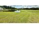 Picturesque pond on grassy lot in residential community at 10636 Millriver Dr, New Port Richey, FL 34654