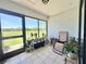 Bright sunroom with tile flooring, sliding glass doors, and beautiful outside view at 10636 Millriver Dr, New Port Richey, FL 34654