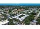 An aerial view displays the property with nearby neighborhood, showcasing the surrounding community at 11485 Oakhurst Rd # 310, Largo, FL 33771