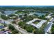 An aerial view shows the property's community, close to the neighborhood and pond at 11485 Oakhurst Rd # 310, Largo, FL 33771