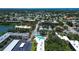 An aerial view displays the property's location within a lush, green neighborhood near a lake and amenities at 11485 Oakhurst Rd # 310, Largo, FL 33771
