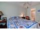 Bedroom features a queen bed and attached bathroom at 11485 Oakhurst Rd # 310, Largo, FL 33771