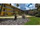 Courtyard featuring manicured landscaping and outdoor seating areas with charming greenery at 11485 Oakhurst Rd # 310, Largo, FL 33771