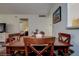 Charming dining room showcasing a wooden table and chairs, decor, and a view to the Primary bedroom at 11485 Oakhurst Rd # 310, Largo, FL 33771