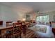 Spacious living room featuring a dining area and access to the lanai at 11485 Oakhurst Rd # 310, Largo, FL 33771