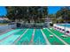 A view of the community's shuffleboard courts, with the pool and other recreational amenities nearby at 11485 Oakhurst Rd # 310, Largo, FL 33771