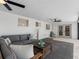 Relaxing back porch with comfortable seating, ceiling fans, and easy access to the indoors at 1154 64Th S Ave, St Petersburg, FL 33705