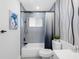 Stylish bathroom with modern fixtures, tub, shower, and decorative wallpaper at 1154 64Th S Ave, St Petersburg, FL 33705