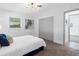 Bright bedroom with a queen bed, carpet, large closet, and natural light from the window at 1154 64Th S Ave, St Petersburg, FL 33705