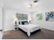 Bedroom featuring cozy decor, plush pillows, and dual bedside lamps at 1154 64Th S Ave, St Petersburg, FL 33705