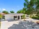 Charming single-story home with a well-manicured lawn, white rock landscaping, and a one car garage at 1154 64Th S Ave, St Petersburg, FL 33705