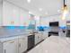 Lovely kitchen with modern appliances, marble countertop and stylish white cabinets at 1154 64Th S Ave, St Petersburg, FL 33705