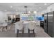Spacious kitchen featuring stainless steel appliances, island seating and modern lighting at 1154 64Th S Ave, St Petersburg, FL 33705