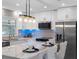 Contemporary kitchen with white cabinetry, stainless steel appliances, and a stylish island at 1154 64Th S Ave, St Petersburg, FL 33705