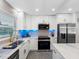 Elegant kitchen featuring stainless steel appliances and modern fixtures at 1154 64Th S Ave, St Petersburg, FL 33705