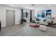 Modern living room featuring an open floor plan and a glimpse of the exterior view at 1154 64Th S Ave, St Petersburg, FL 33705