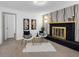 Inviting living room with a fireplace, modern decor, and stylish light fixtures at 1154 64Th S Ave, St Petersburg, FL 33705