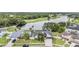 Scenic aerial view of a home near a golf course and a picturesque lake at 1222 Rainbrook Cir, Valrico, FL 33596