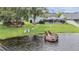 Aerial view showcasing the home's backyard, dock, and waterfront access at 1222 Rainbrook Cir, Valrico, FL 33596