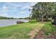 Lakeside backyard featuring a dock for enjoying waterfront activities at 1222 Rainbrook Cir, Valrico, FL 33596