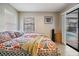 Cozy bedroom offers bright natural light, with an adjacent door leading to the pool at 1222 Rainbrook Cir, Valrico, FL 33596