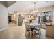A lovely dining area showcases natural light from a sliding door and access to other rooms at 1222 Rainbrook Cir, Valrico, FL 33596
