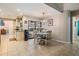 Bright dining area features tile floors, backyard views, and a charming chandelier at 1222 Rainbrook Cir, Valrico, FL 33596