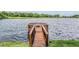 A private wooden dock provides direct access to the serene lake at 1222 Rainbrook Cir, Valrico, FL 33596