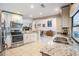 Modern kitchen with stainless steel appliances, granite countertops, and ample cabinet space at 1222 Rainbrook Cir, Valrico, FL 33596