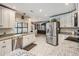 Spacious kitchen with stainless steel appliances, granite countertops, and an open floor plan at 1222 Rainbrook Cir, Valrico, FL 33596
